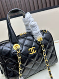 Black patent leather quilted Boston bag