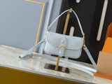 Light-colored embossed leather mini handbag collection