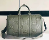 GG embossed leather travel bag