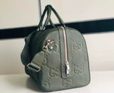 GG embossed leather travel bag