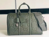 GG embossed leather travel bag