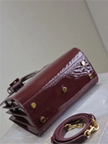 Sac De Jour burgundy patent leather handbag