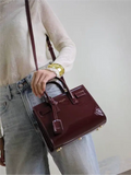 Sac De Jour burgundy patent leather handbag